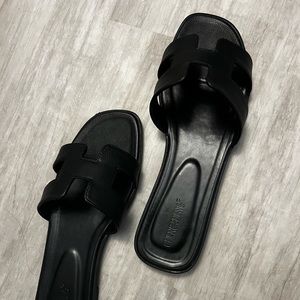 Pebbled black slip on sandals